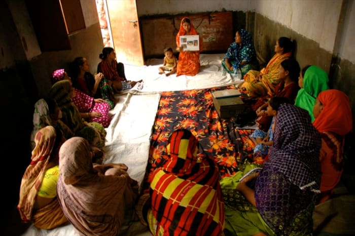 Women in Bangladesh attend a pre-natal education class in which they learn proper nutrition, hygiene, and health tips for their pregnancy.