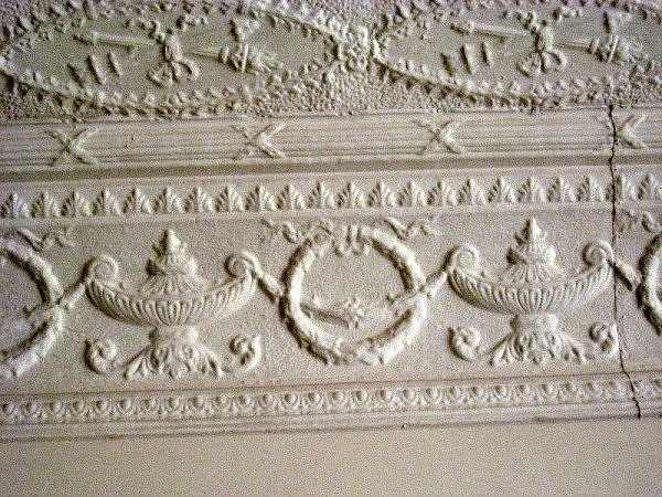 This design was in a building in Whitewater, Kansas. It shows how the wall and the ceiling meet with the design carried down to form a border.