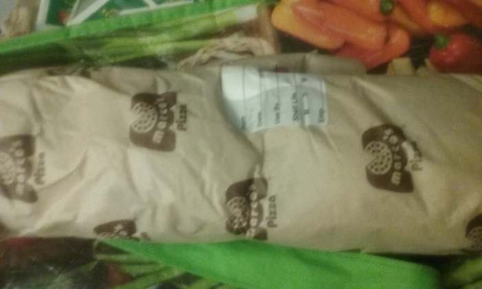 A Marco's Pizza Restaurant sandwich wrapped in simple brown paper packaging with the Marco's Pizza Restaurant logo.