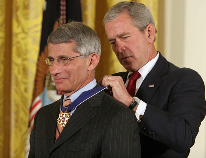 Dr. Anthony Fauci receives the Medal of Freedom Award from President George W. Bush