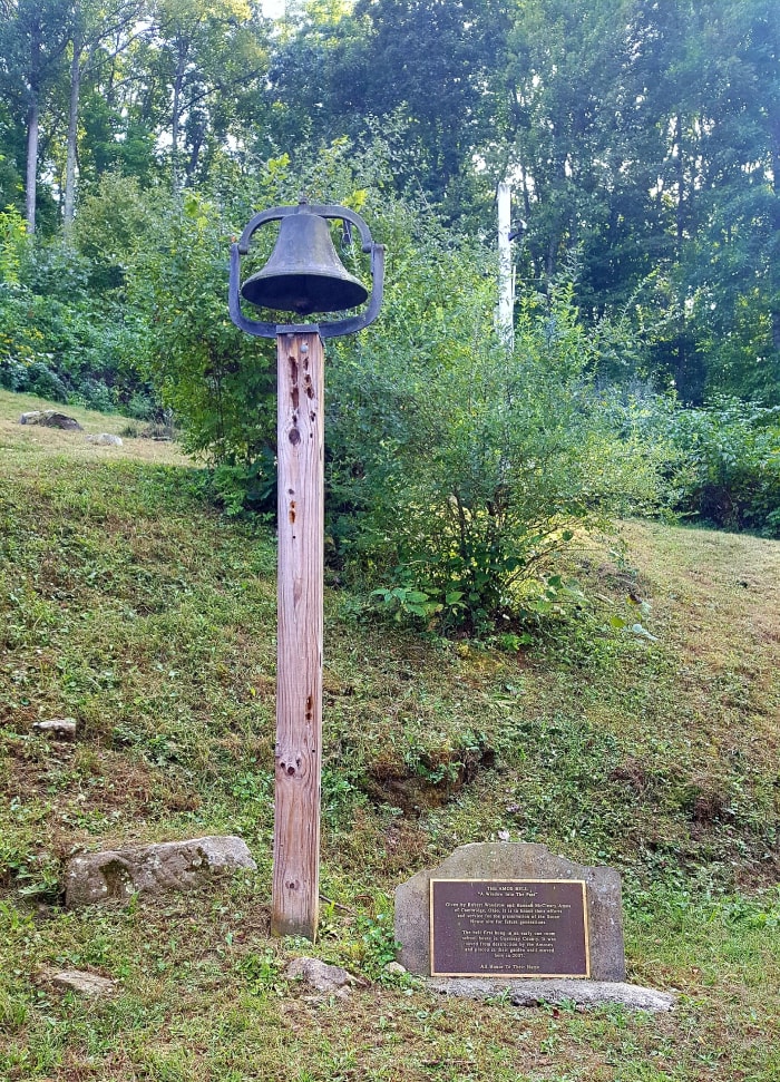 The Amos Bell. It once hung in an early one room school house in Guernsey county. Saved from destruction, it now resides here to honor the efforts and service of Robert Woodrow and Hannah McCleary Amos for the preservation of the Stone House site.
