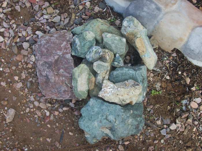The Lost Esmeralda Mine had a greenish colored ore. Esmeralda means emerald in Spanish. The photo shows green rocks I have found in many Arizona locales.