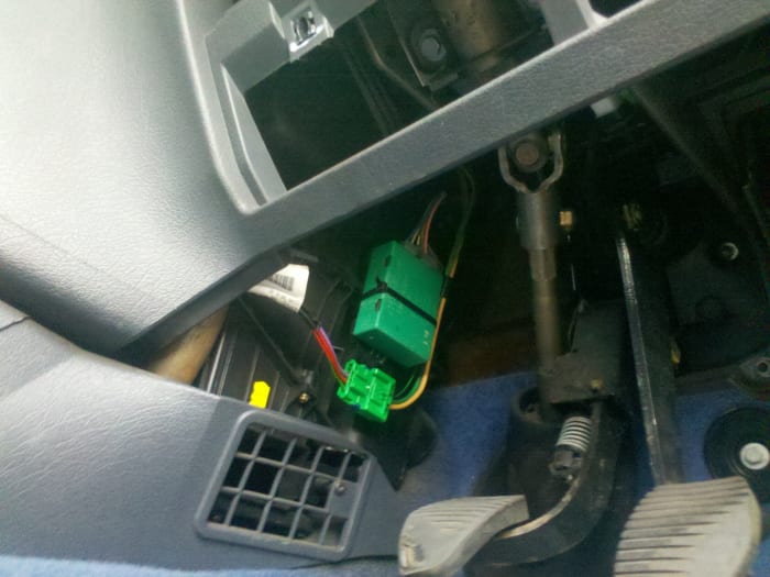 Location of the Electric Window Module (ECM) on the Citroen Berlingo (Mark 1) attached to the side of the heater assembly on the driver's side.