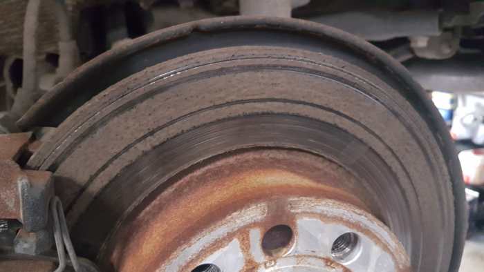 Brakes can suffer from corrosion and uneven wear if brake fluid isn't replaced at regular intervals. This brake disc is from a Volkswagen Golf which had scored discs as a result of poor quality maintenance using cheap aftermarket parts (substandard)
