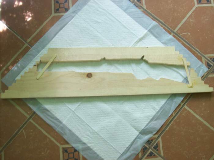 Backboard repair if you accidently break through the left or right as I did (popsicle sticks.) This is the back side of what was left over after cutting, used as mounting board.