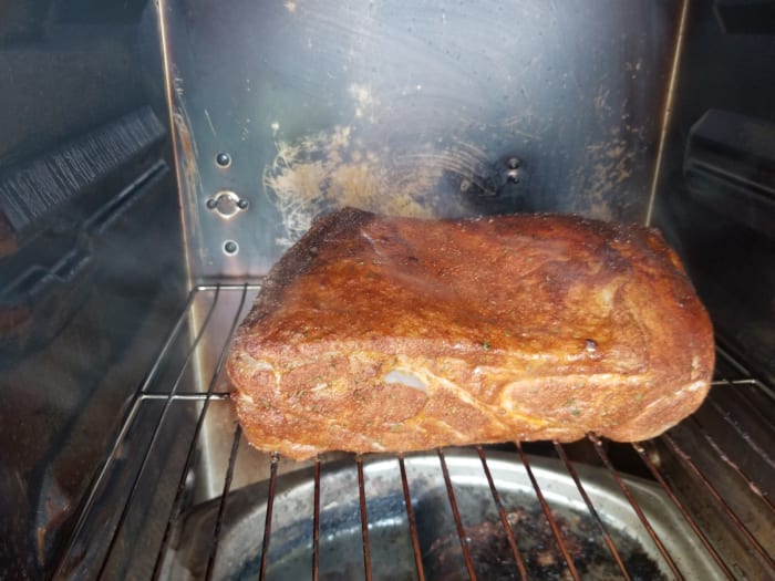After being in a brine for 12 hours, the pork is ready to be smoked. My smoker is set at 225 degrees with some hickory wood chips.