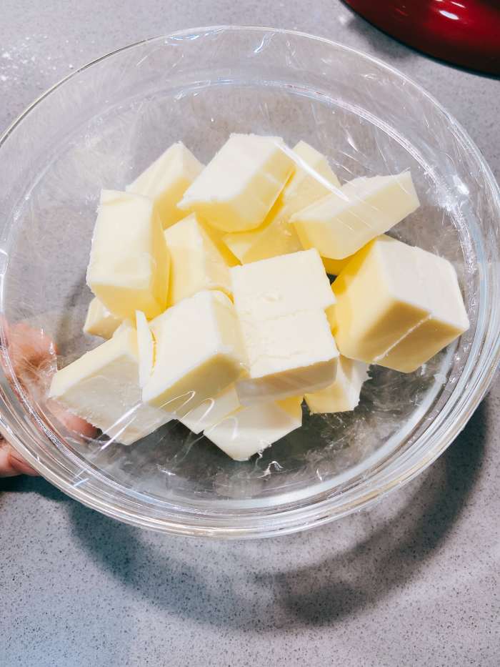 The cold butter. I would recommend cutting the butter into pieces and letting it sit in the fridge until it's ready to add to the mixture.
