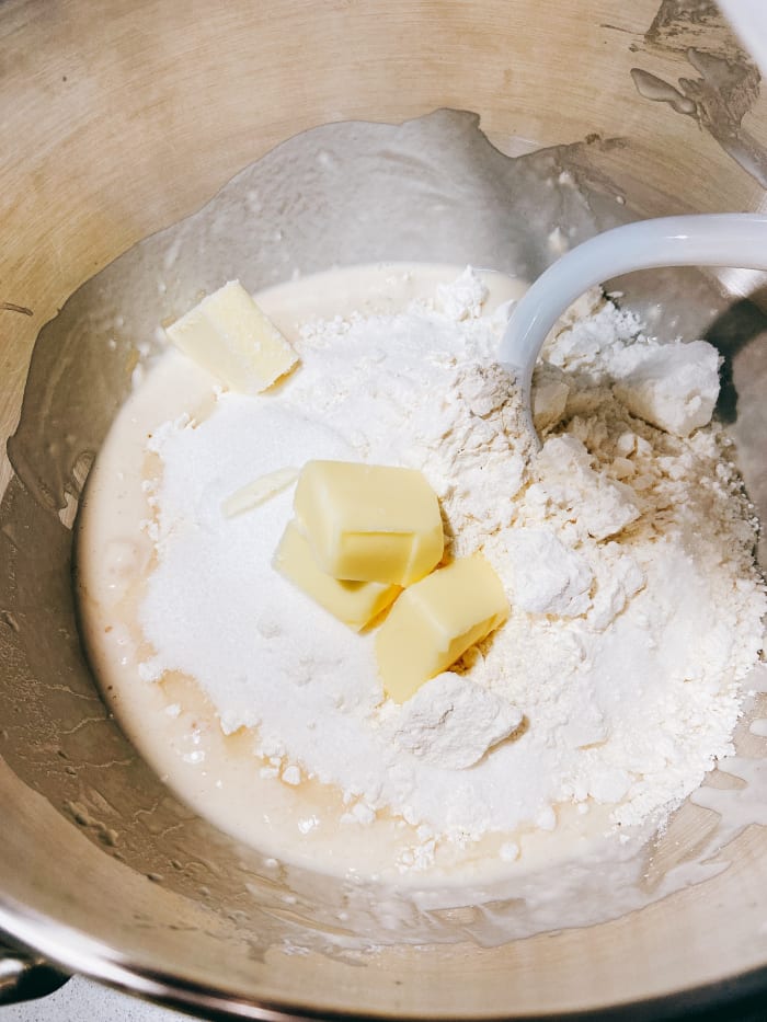 Combine the all-purpose flour, pastry flour, half of the butter, and sugar. In a lower speed, mix the mixture.