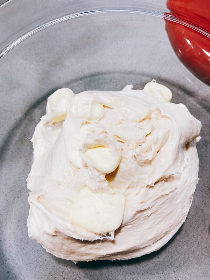 Take the dough out from the mixer and transfer to a bowl. Cover with cling wrap and let it stand for 30 minutes before putting it in the fridge.