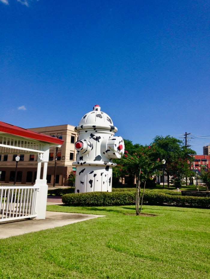 This was my first glimpse of the world's largest working fire hydrant. It was spring when we visited, and the trees had pretty red flowers on them.