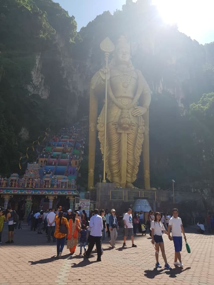 For better photos without so many tourists, get to the Batu Caves earlier (don't miss your train like we did).