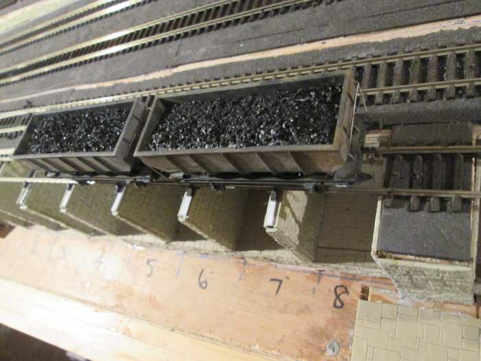 Overhead view of the coal cells with a pair of ex-LNER 21 ton steel hoppers (Diagram 100). Sleepers removed over cells, with sleepers kept on cell walls to retain track gauge. ..