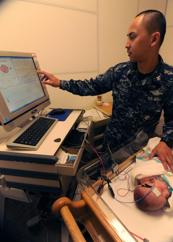 A baby receives a newborn hearing screening test.