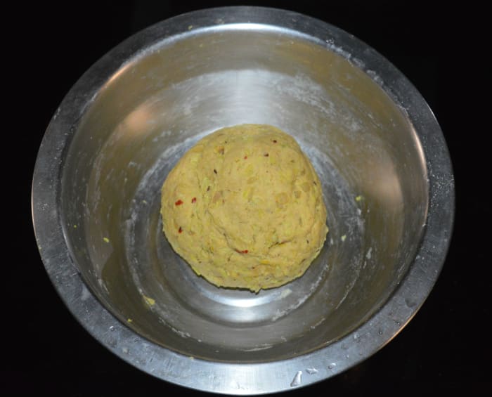While adding very little water, make a firm and smooth dough. Cover it and set aside for 5 minutes. Next, softly knead it once again.
