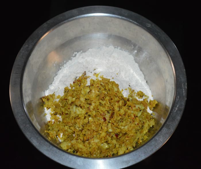 Transfer the mixture to a large mixing bowl. Allow it to cool. When it comes to room temperature, add wheat flour.