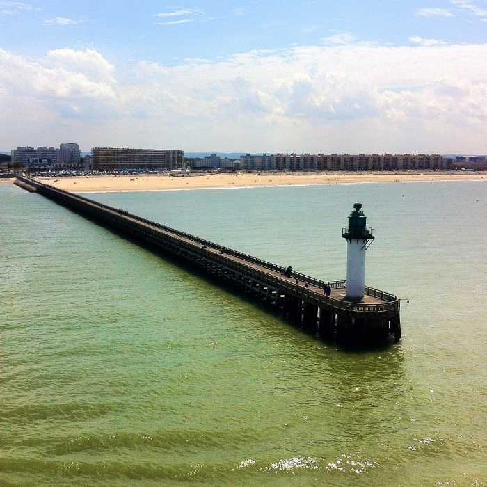 The pier and lighthouse of the port of Calais