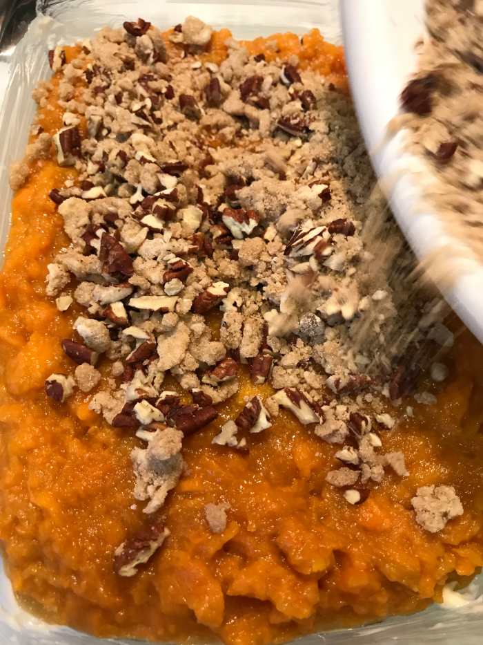 Spread the topping on the sweet potatoes, and bake at 350F for about half an hour, until golden brown on top and bubbly throughout.