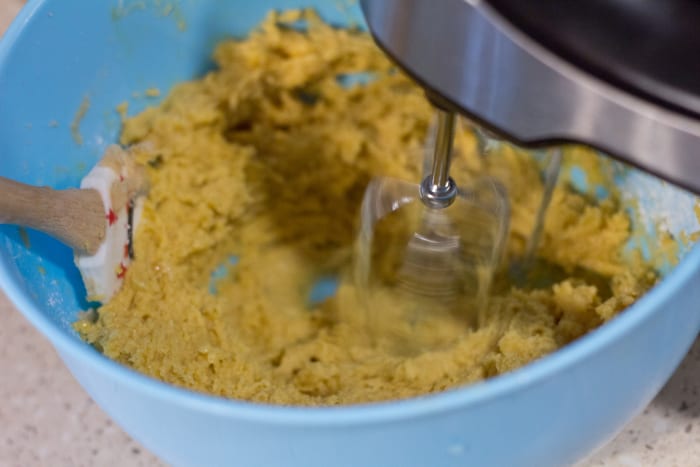 Mix in the eggs, vanilla, and pudding with a hand beater, before adding in the dry ingredients.