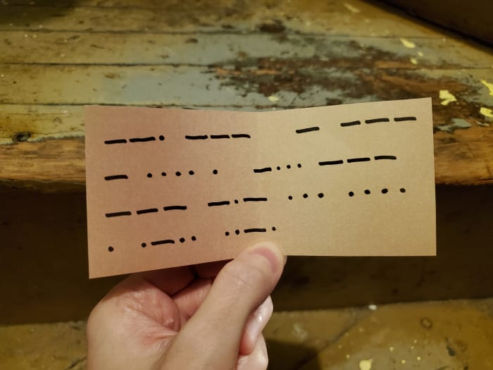 I got the answer 195, which told me to go to the stairs. This next clue appears to be written in some sort of code. Are those dots and dashes?