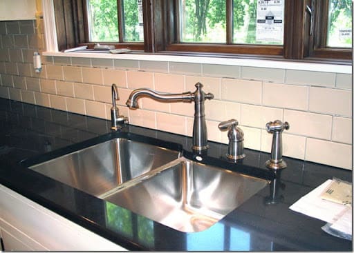 Beautiful food preparation sink and faucet with filtered water mounted under the kitchen counter top
