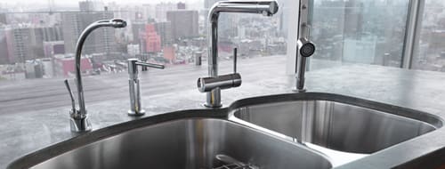 Beautiful food preparation sink and faucet with filtered water mounted under the kitchen counter top