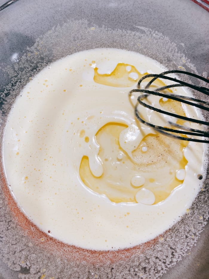 Add the vanilla extract, half and half, vegetable oil, lemon zest, and lemon juice. Stir to combine.