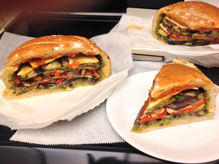 Vegetarian Muffuletta Sandwich with grilled eggplant, zucchini, purple onion, red pepper, and portabella mushrooms