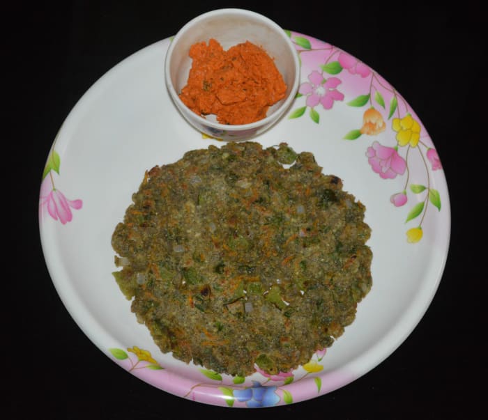 Remove it with the help of a spatula and place it on a plate. Serve it with coconut chutney or tomato sauce. Repeat the same with the remaining dough to make more roti.