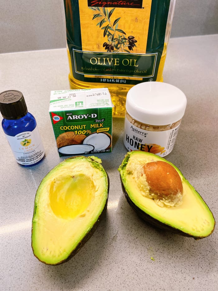 Only five ingredients are needed for this hair mask. Ripe avocado, raw honey, coconut milk, olive oil, and lemon essential oil.