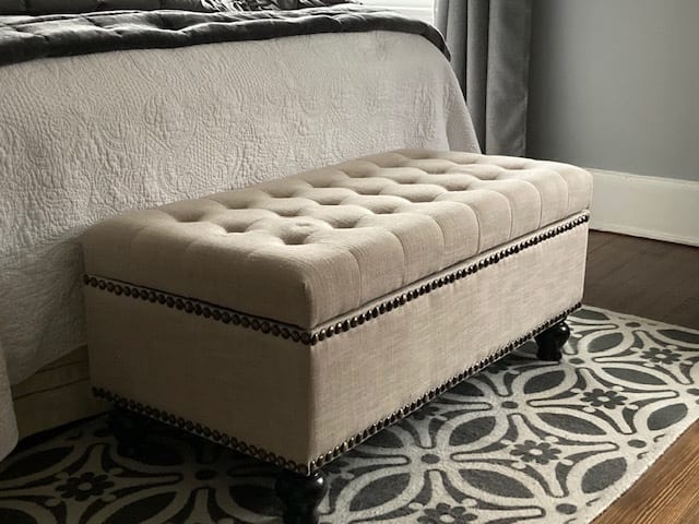I love how this storage bench looks in my room and right now I have 2 large down blankets in there with room to spare.
