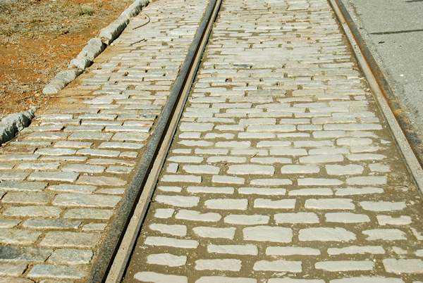 Tracks Everywhere! What a lot of people don't realize is that most of the major streets of Lynchburg are still Cobblestones and Trollycar Tracks like these covered in Asphalt. These tracks are now covered for the convenience of someone.