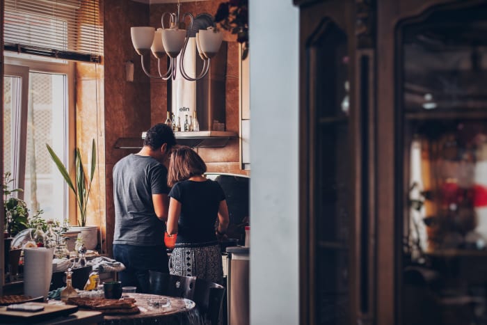 Cooking at home together right now will save money and give you both something to focus on that's not anxiety about the future.