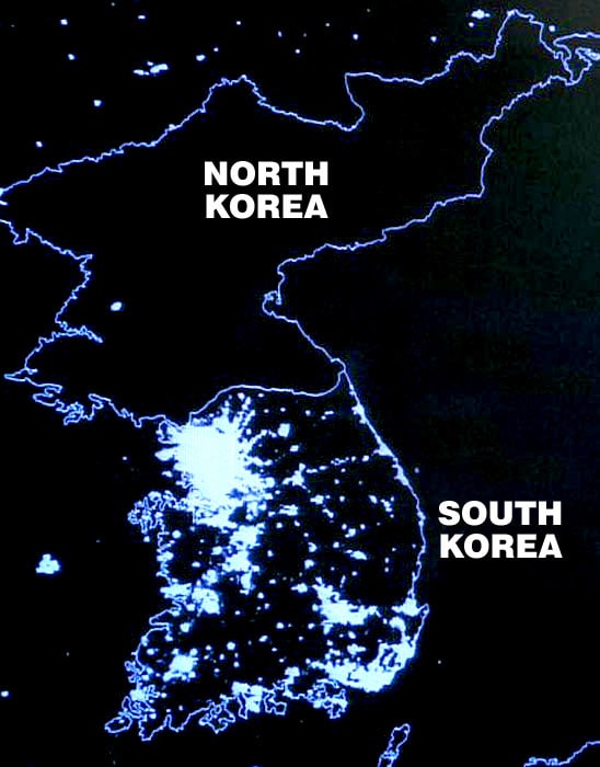 KOREA AT NIGHT; SOCIALIST NORTH POVERTY STRICKEN AND IN THE DARK; CAPITALIST SOUTH PROSPEROUS AND TOTALLY ELECTRIFIED