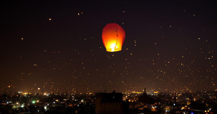 The Night Lit Up on Makar Sankranti Uttarayana Festival with Kites and Lights.