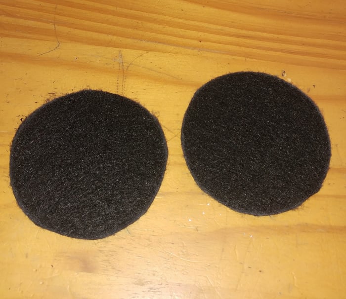 I Used a mason jar lid to measure a perfect circle. You may use white chalk to draw around lid on the black felt. The chalk makes it easier to see what your going to cut out.