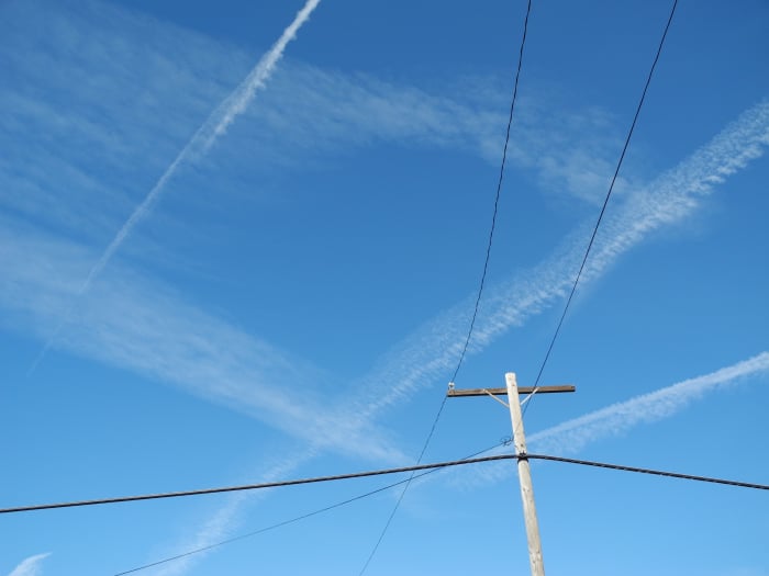I was walking my dogs and witnessed a complete chemtrail attack resembling crop dusting. The area that I was walking in, was completely COVERED with chemtrail planes flying non-stop cross grid patterns in the sky, quickly distributing into Clouds.