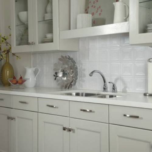 White backsplash tins are vintage styles on below the cabinets. The pressed tins are white backdrops.