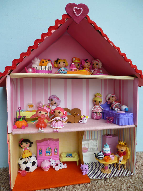 Lalaloopsy is a fantastic doll choice for toddler girls. These Lalaloopsy dolls have found their home in a dollhouse made for them.