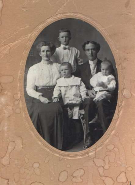 My Great-Grandparents John James Sanders and Catherine Merrick Sanders with my Grandfather William Bertram Sanders, the tall lad between his parents. c. 1908
