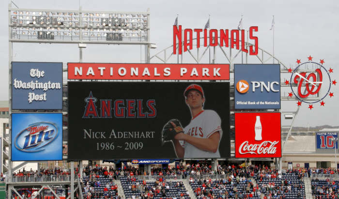 The Washington Nationals display a tribute to late Angels pitcher Nick Adenhart after he died suddenly in a vehicle accident at age 22 at the start of the 2009 season.