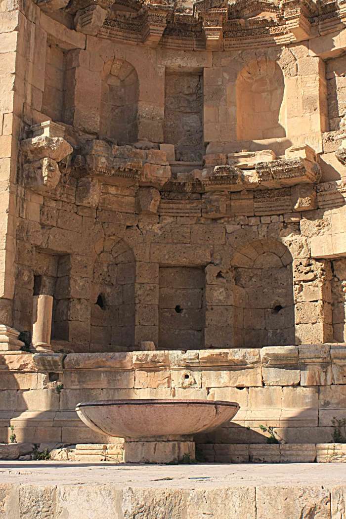 The late 2nd century Nymphaeum, or public fountain near the Temple of Dionysus. The large bowl collected the waters of the fountain