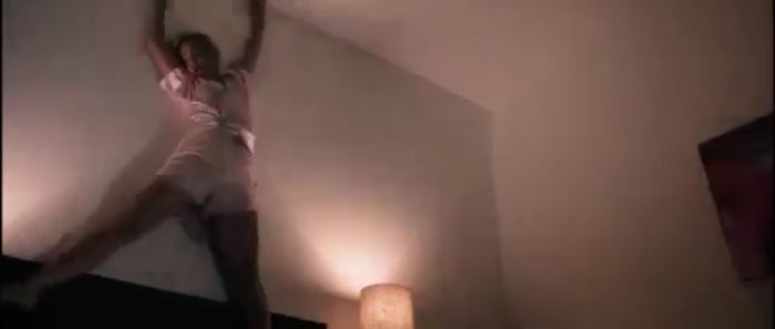 She gets dragged around onto the walls and ceiling by the way, just like in A Nightmare on Elm Street... ya know... like I'm sure the real life Nicole Simpson went through.