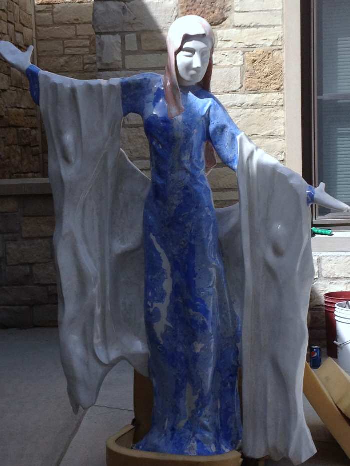 Greg's latest artwork, The Virgin Mary, is featured at the local catholic church. Do you see the angels in the design?