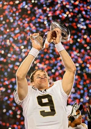 Brees holding up the Lombardi Trophy after Super Bowl XLIV where the Saints defeated the Colts 31-17.