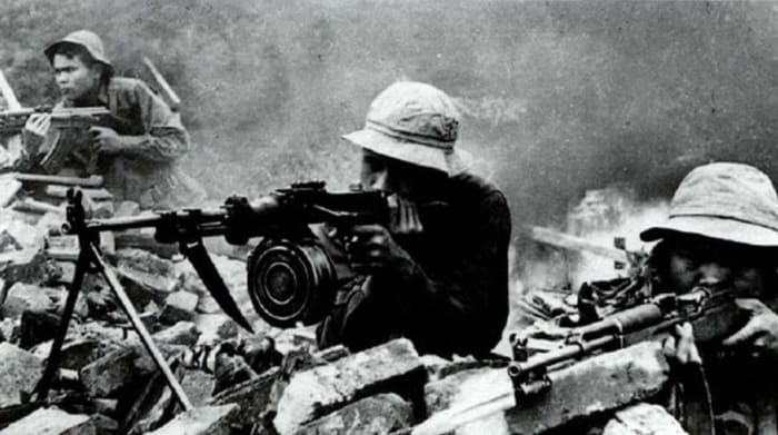 NVA firing at American Marines during the battle for Hue. Around 8,000 NVA regulars or VC insurgents lost their lives in Hue.