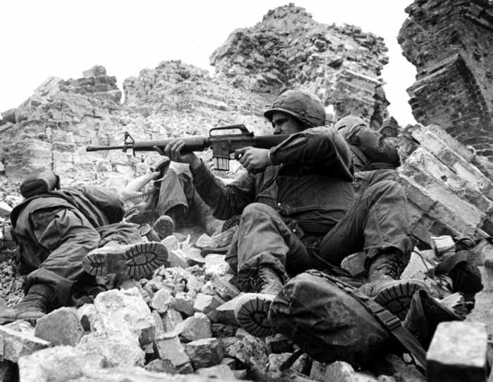American Marines firing at VC in Hue January 1968. The walls of the Citadel are noticeable in the photograph. In Vietnam the average infantryman saw 240 days of combat in one year.