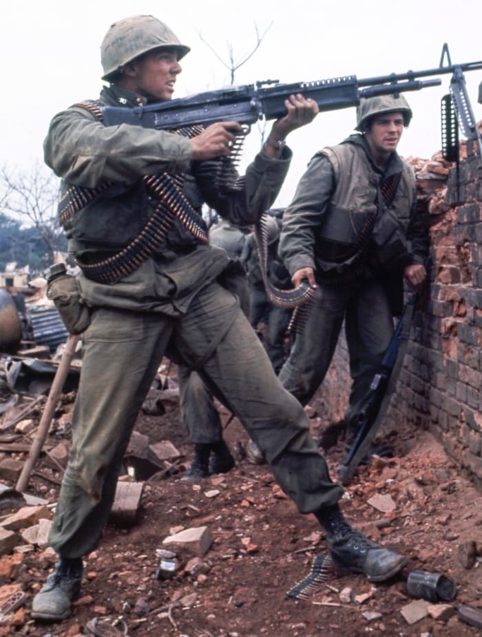 An American Marine firing an M-60 machine gun at NVA inside the Citadel of Hue 1968. The average age for an American infantry man in Vietnam was twenty-one. Over 1700 Americans are still missing over 55 years after the end of the Vietnam War.