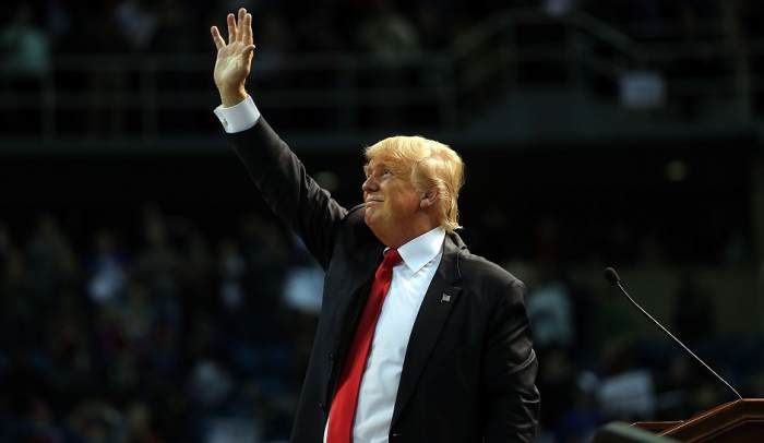 Trumps saluting his followers whom he made to pledge to vote for him, with what looks like a Hitlerian Salute..
