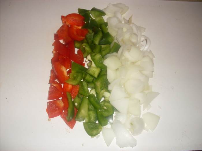 Colorful, flavorful and delightful, the green pepper, red pepper and onion adds pizzazz for this delicious paella recipe.