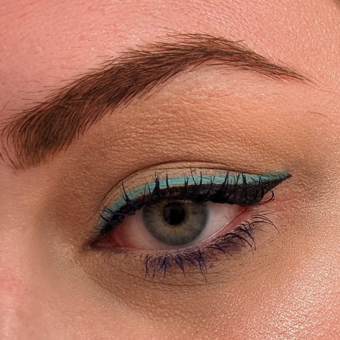 Double up your liner with Stila Stay All Day Liquid Liner in "Intense Black" and LA Girl Shockwave Neon Eyeliner in "Fresh."